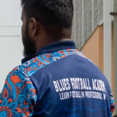 A shot of one of our coaches, whose jersey reads "Learn football in a professional way." This reflects the high standard of coaching and organization at our events.