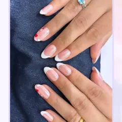 Another angle of this lovely French manicure with a romantic twist. The classic look is updated with subtle heart details, showing how a small touch can personalize a timeless style.