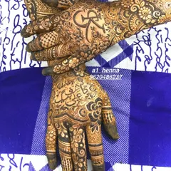 A close-up of a bridal henna design, showing how my organic cones can be used for personalized details like incorporating initials. The fine lines and deep color are a testament to the quality of the paste.