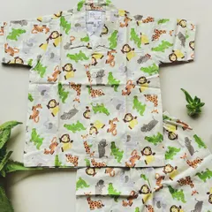 Get ready for a jungle adventure with this adorable animal print pajama set. Featuring friendly monkeys, giraffes, and crocodiles, this 100% cotton outfit is designed for wild dreams and cozy nights.