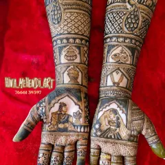 A beautiful depiction of a bride and groom in traditional wedding attire. This portrait mehendi uses negative space to make the figures stand out, framed by classic patterns.