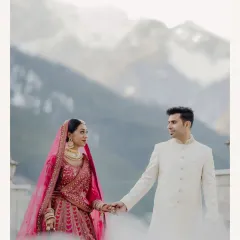 A classic couple portrait against the soft backdrop of the Manali mountains. The composition is clean and elegant, focusing entirely on the couple's connection and their loving gaze.
