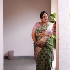 A moment of quiet joy. The soft silk and intricate zari motifs of the saree are designed to make expecting mothers feel comfortable and beautiful.