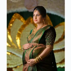 A poised and elegant portrait of a mother to be at her baby shower. We pay close attention to detail, from the intricate embroidery on her blouse to the rich gold jewelry, ensuring every element is captured beautifully.