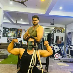 A classic gym mirror selfie with my big brother. We are powerlifters who train hard together.