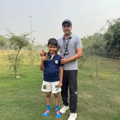 Celebrating a victory with one of my young champions. Seeing my students succeed and earn medals is the greatest reward of being a coach.