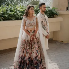 Stepping into a carnival of colors with style and grace! This daytime look features soft, natural makeup that lets her vibrant floral lehenga be the star.
