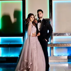 A full-length view of our embellished tuxedo, showing how it creates a sharp and sophisticated silhouette. Paired with a classic bow tie, this look is crafted to own the night at any formal event or wedding reception.