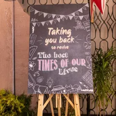 Setting the theme from the moment guests arrived. This chalkboard sign welcomed everyone to the 'Back to School' 25th anniversary party, promising a night of reviving the best times of their lives.