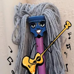 A creative concept showing how a brand mascot can be born from an unconventional idea. This character, made from a mop, is designed to be quirky, musical, and unforgettable.