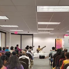 A view from the back of the room during our Chicago concert. This shows how a sitar performance can be adapted for different spaces, from large auditoriums to smaller community halls.
