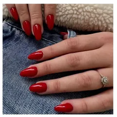 You can never go wrong with classic red. This set features a vibrant, glossy red polish on medium-length almond nails for a timeless and confident look.