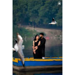Your love story deserves a beautiful setting. For this pre-wedding shoot at Yamuna Ghat, we created a serene and timeless portrait, capturing the couple's connection amidst the calm waters and flying birds.