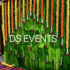This backdrop is made entirely of fresh banana leaves, creating a lush, green canvas. The vertical garlands of marigold and jasmine add a classic festive element for any auspicious occasion.