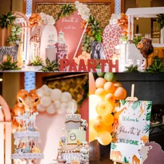 A vibrant jungle-themed birthday setup featuring multiple cakes, a welcome sign, and a backdrop filled with animal characters and safari elements.