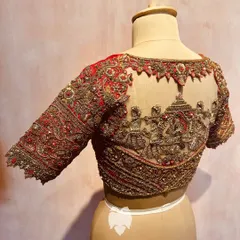 A different angle of the wedding procession blouse, highlighting the masterful detail of the zardosi threads and shimmering beads.