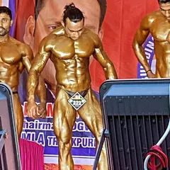 A shot from a competition, showcasing the results of a strict diet and relentless training. This is peak conditioning.