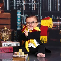 A round of applause for our newest Gryffindor. This little wizard's happy expression and clapping hands perfectly capture the magic of the moment.