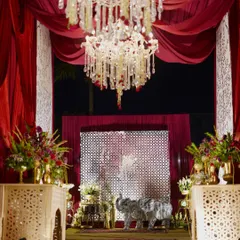 A glimpse into an era of love and passion. This entrance features shimmering elephant statues, grand chandeliers, and rich red drapes, creating a truly royal and indulgent experience.