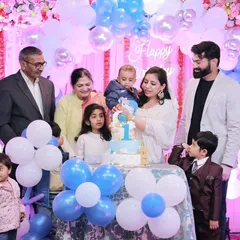 A beautiful family portrait around the cake for Vedang's first birthday. I make sure to get these essential group shots that bring together multiple generations for the celebration.