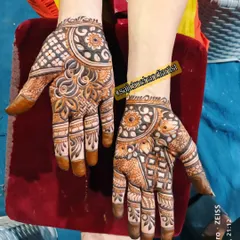 I used bold strokes and shading in this design to create depth. The mix of floral circles, leaf patterns, and checkered fills gives the hands a very full and festive appearance.