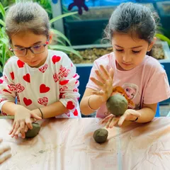 The process of creating is a lesson in patience and focus. These girls are carefully molding eco-friendly clay to create their own idols for the Ganesha festival.