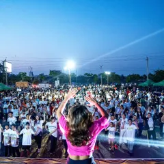 On stage, facing a sea of enthusiastic participants at the Tealathon in Amritsar. This is my happy place, sharing the joy of fitness with thousands of people.