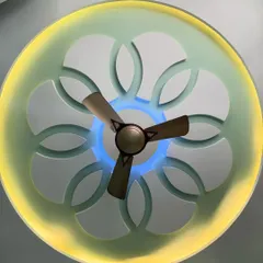 This custom false ceiling features a floral cutout design with dual-color LED lighting. The outer ring provides warm ambient light, while the center has a cool blue accent, creating a stunning visual effect day or night.