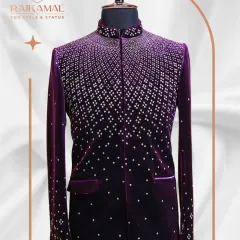 For a truly royal entrance, this deep purple velvet Jodhpuri suit is unmatched. The cascading sequin work catches the light beautifully, making it an opulent choice for a groom or anyone wanting to command attention at a grand celebration.