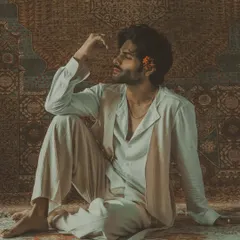 A moody, artistic shot highlighting the intricate craftsmanship of the garment, which mirrors the delicate emotions of the ghazal it was inspired by.