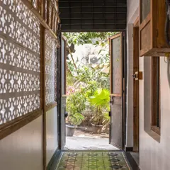 A view from the studio hallway into the garden. The original jaali work on the wall casts beautiful shadows as the light changes throughout the day. It’s these small, preserved details that give the space its unique character and charm.