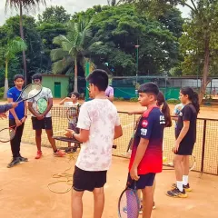 Our coach providing detailed instruction to the advanced batch. These sessions are focused on refining technique and developing match-winning strategies.