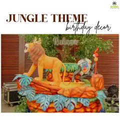 An overview of our "Jungle Theme" birthday decor. This setup features life-sized statues of Simba and Rafiki on a Pride Rock-inspired stage, creating an immersive experience.