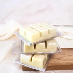 Melted soy wax means endless comfort. A stack of our classic wax melt clamshells.