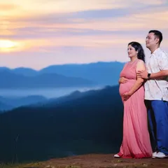 An epic maternity portrait of a couple overlooking a misty mountain range at sunrise. I can travel to scenic locations to create truly unforgettable and breathtaking images for you.