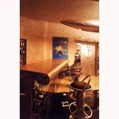 The bar counter itself is crafted from the wing of an airplane, demonstrating how we can rewrite the context of old materials to create functional art.