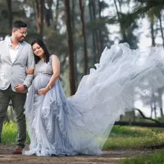 Celebrate your journey together. This photo shows our popular grey embellished trail gown, perfect for couple photoshoots. We also offer coordinating blazers for dads-to-be to complete the look.