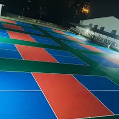 Our courts are fully lit and open 24/7 for those late-night matches or early morning practice sessions. This shot shows the arena after dark, highlighting the bright, even lighting across all playing surfaces.