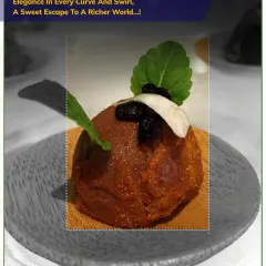 Elegance in every curve and swirl. This rich, chocolate-based dessert is garnished with fresh mint, offering a sweet escape to a richer world.