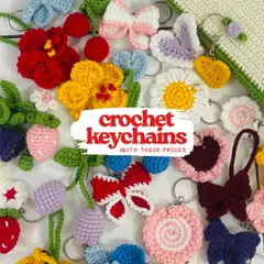 Here's a big flat lay of all the different floral and character keychains I offer. You can see everything from butterflies and daisies to strawberries and cherries.