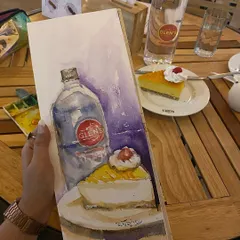 The same cheesecake sketch, shown alongside the real thing. I love doing these still life paintings on my favorite Lilorosh sketchbook.