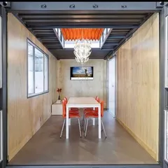 We transform industrial containers into sophisticated work environments. This meeting room showcases our attention to modern design, with clean lines, natural light from a custom skylight, and all the integrated technology needed for a productive business hub.