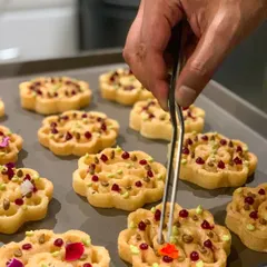 Beautifully shaped rosettes made with umami paste and dotted with beetroot and avocado puree, showcasing the artistry in my canapés.