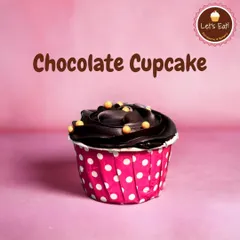 A classic Chocolate Cupcake, perfect for any occasion. It's a moist chocolate sponge topped with a rich swirl of chocolate frosting and a few crunchy pearls for decoration.