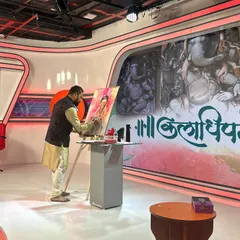 Here I am during a live painting session on Saam TV for their "Kaladhipati" program. I was invited to create a painting of Ganesha, and I chose to portray him as "Bal Ganesh," inspired by my own young son, Yuvraj.