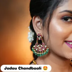 A close-up of my exclusive Jadau Chandbaali earrings. The combination of kundan work with ruby and emerald stones makes them a perfect statement piece for any festive occasion.