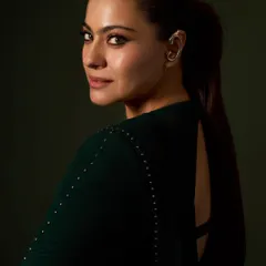 This angle highlights the unique ear cuff and sleek ponytail from Kajol's awards night look, adding a contemporary edge to a classic saree.