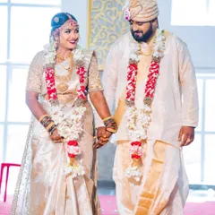 A precious moment from my wedding day. My makeup was designed to be classic and radiant, complementing my off-white and gold Kanjeevaram saree.