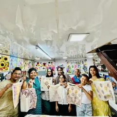 The best part of our workshops is the community. Here's a wonderful group from our World Art Day session, proudly showing off the unique tote bags they designed and printed themselves.