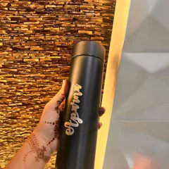 My custom temperature-controlled bottles are perfect for keeping your drinks hot or cold. This one is personalized with the name "Apurva" in an elegant gold script on a matte black bottle.